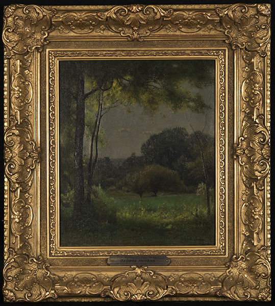 George Inness' "Out of My studio Door" painting depicting a grassy meadow framed in trees and scrubs with a low tree in the middle. 